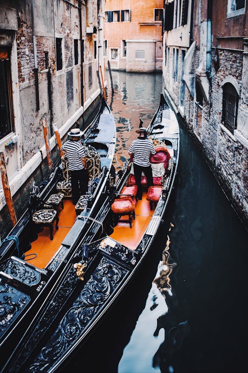 Two Gondolas in a City