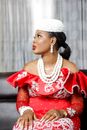 A Woman in Off Shoulder Red Dress with a White Hat