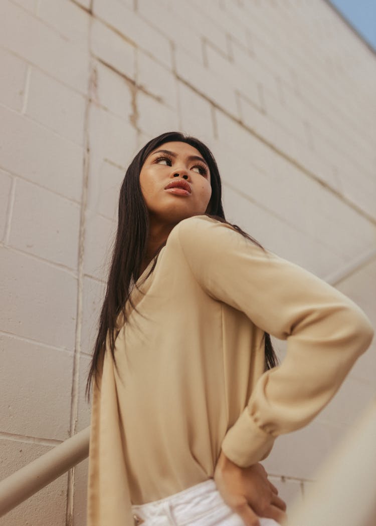 Woman Standing On Stairs And Looking Up