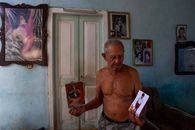 Topless Man in Gray Shorts Holding White Paper