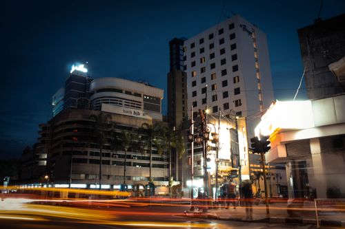 Free Vibrant city lights and light trails capturing the urban night scene of Bandung, West Java, Indonesia. Stock Photo