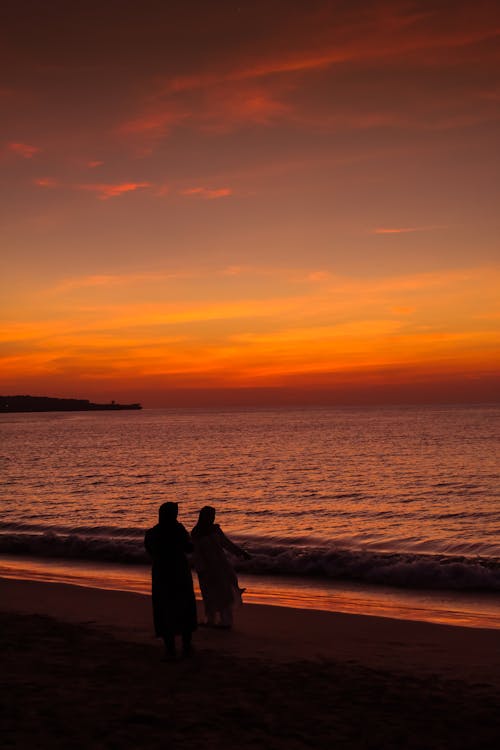 
A Silhouette of Women on a Beach