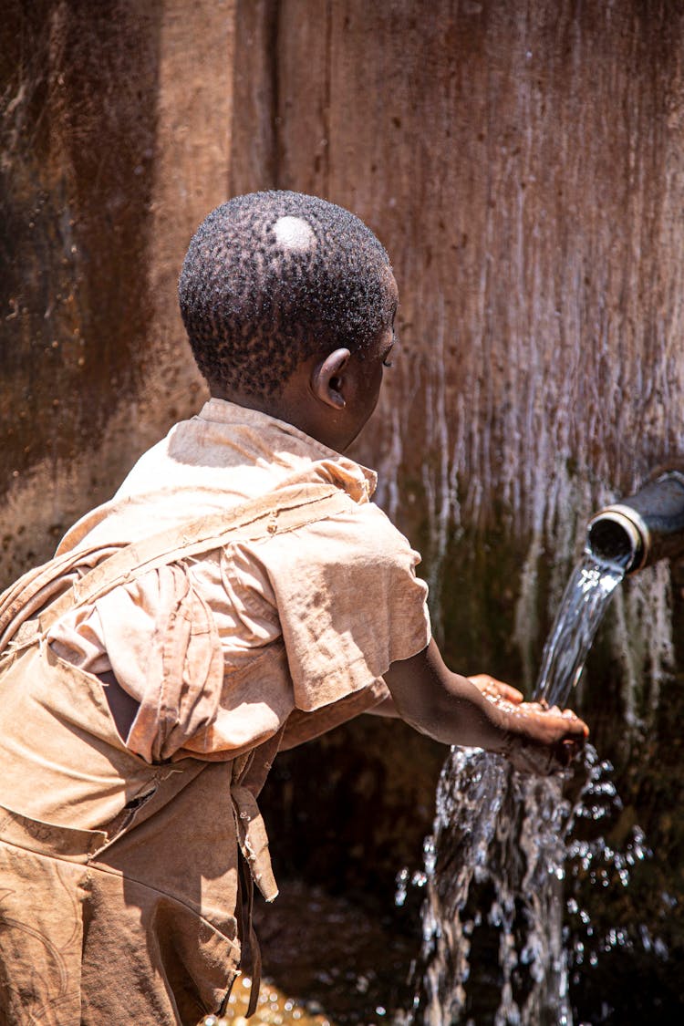 
A Boy Washing His Hands