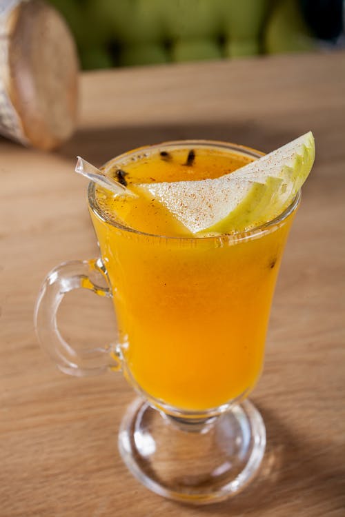 Free Yellow Drink with Fruits on a Mug Stock Photo