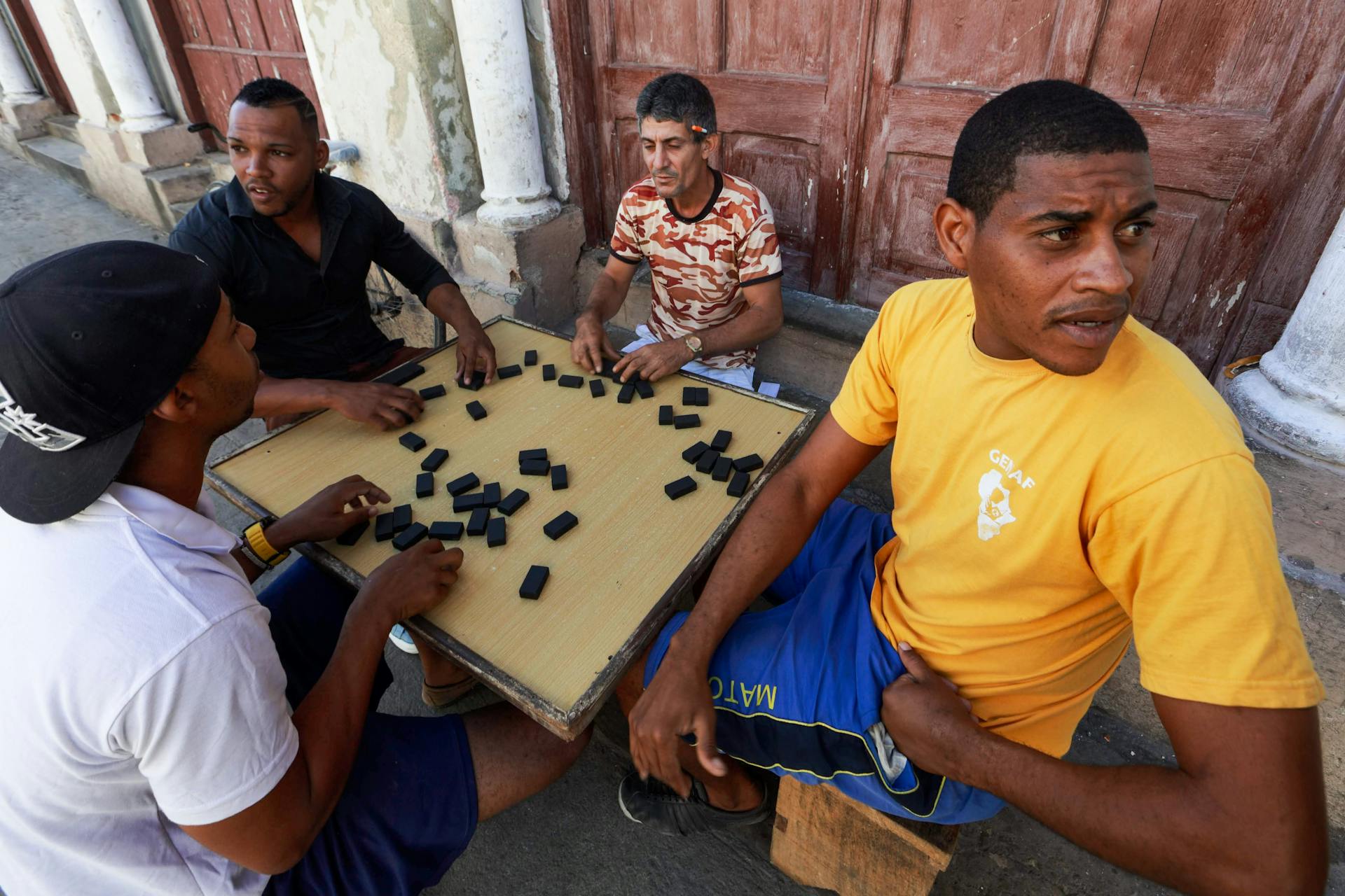 Men Playing Board Game