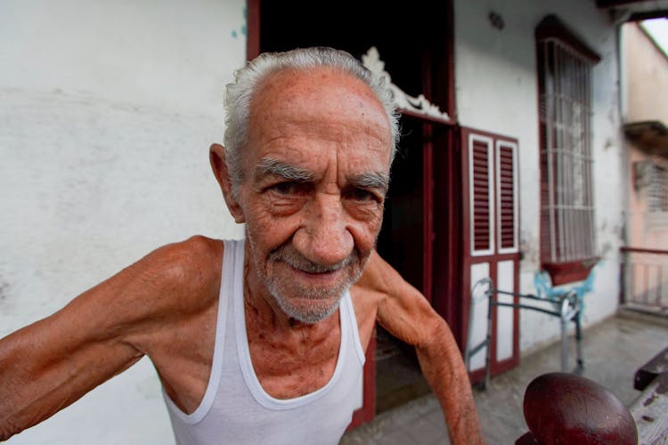 Elderly Man In White Tank Top