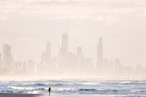 Person Standing on Seashore