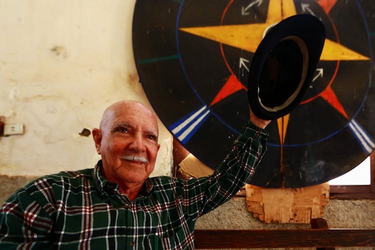 Man Holding His Hat