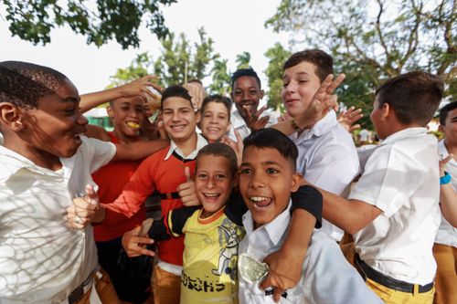 Free Joyful group of boys having fun outdoors, embracing friendship and happiness. Stock Photo