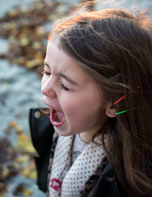 Girl Wearing Black Jacket and Gray Shirt With Open Mouth during Daytime