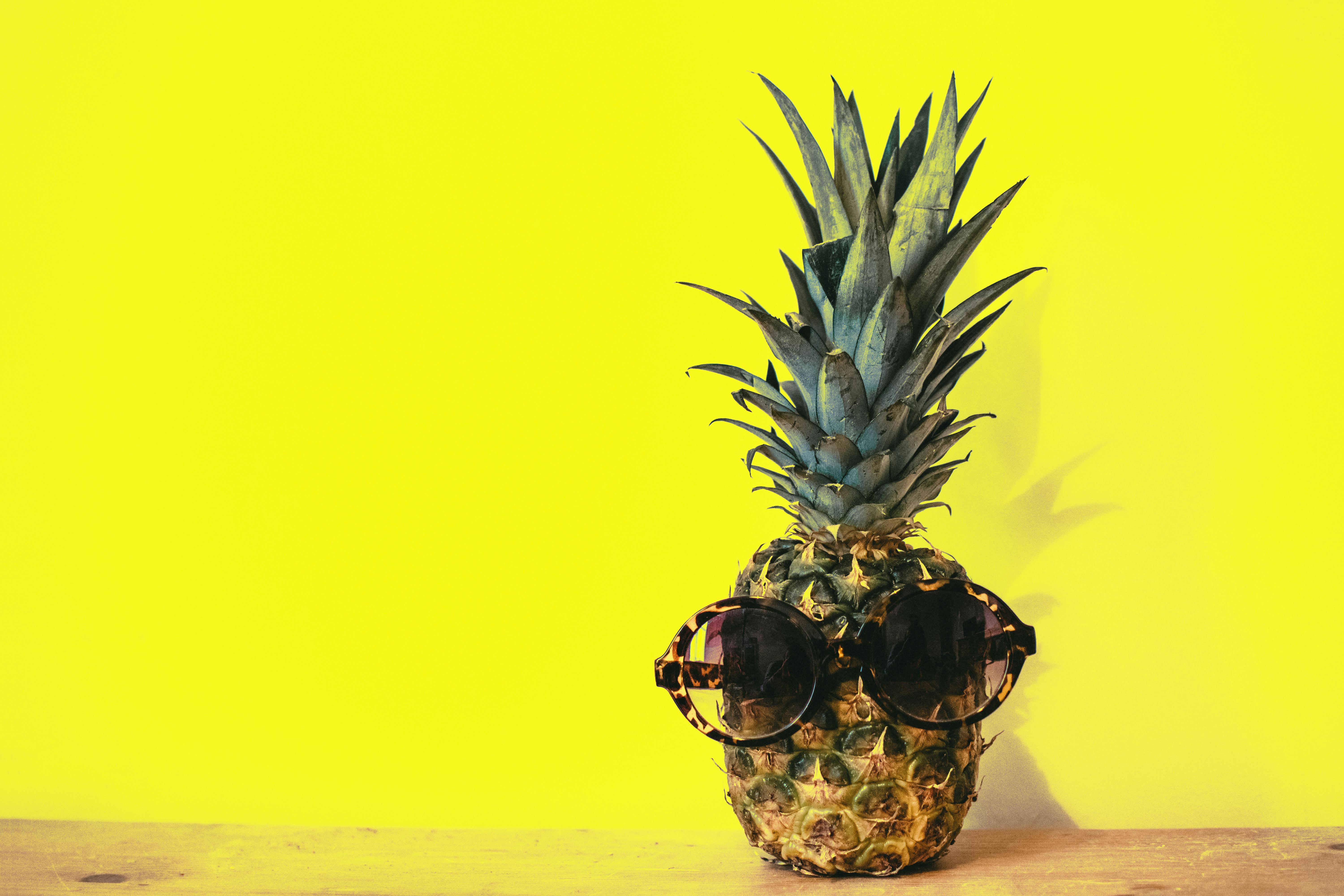 Blue Pineapple On Yellow Background Stock Photo - Download Image