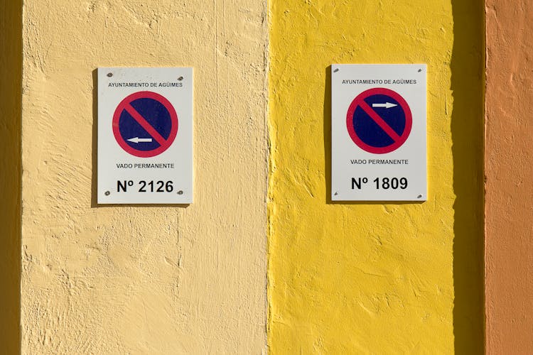 Signs On Yellow Wall