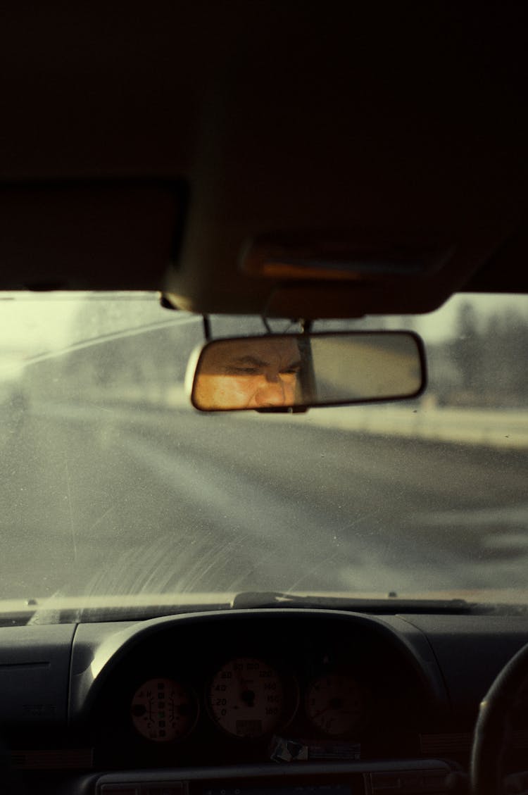 Man Face In Car Mirror