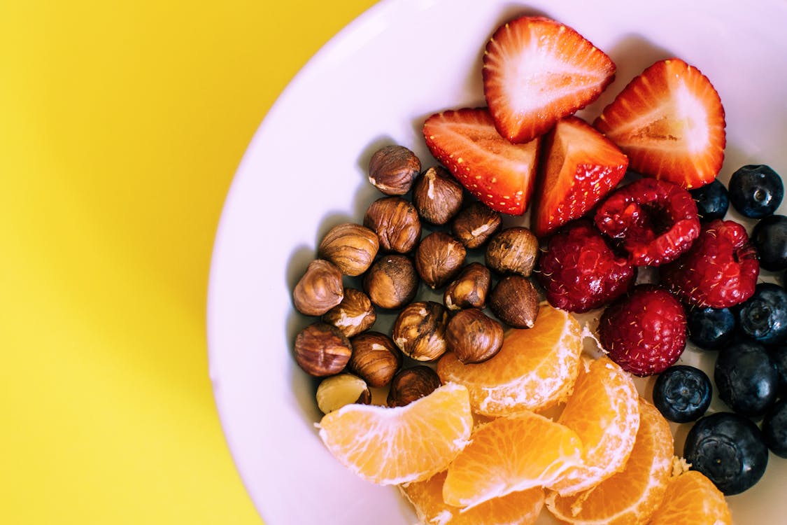 Healthy video's Assorted Fruits on White Ceramic Plate