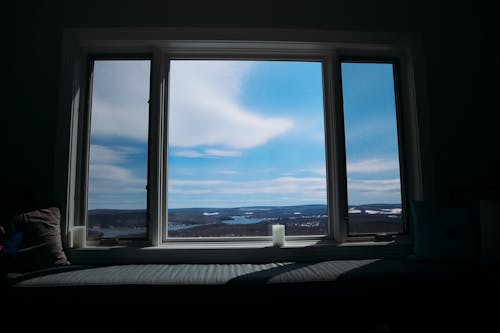 Window Overlooking the Beautiful Sky and Nature