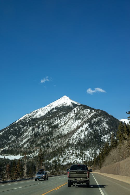 Gratuit Photos gratuites de autoroute, ciel bleu, montagne couverte de neige Photos