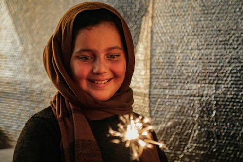 A Child Holding a Sparkler