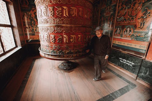 Senior Men in an Ornamental Temple Interior