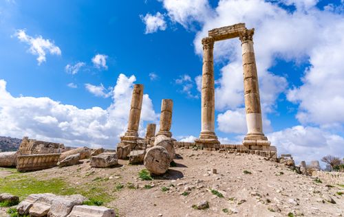 Free Explore the ancient Roman ruins of the Amman Citadel in Jordan under a bright blue sky. Stock Photo