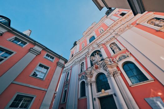 Low angle shot of Poznań's iconic baroque church under a clear sky.