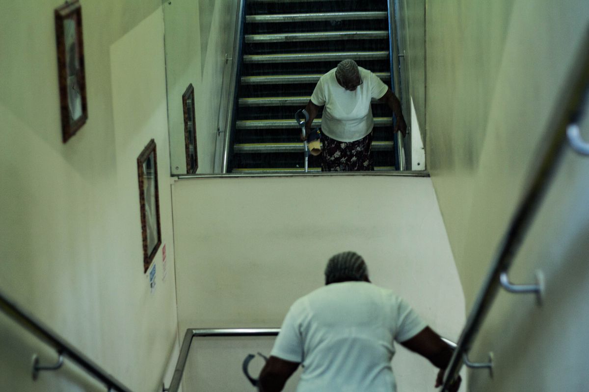 Older adult using a residential staircase