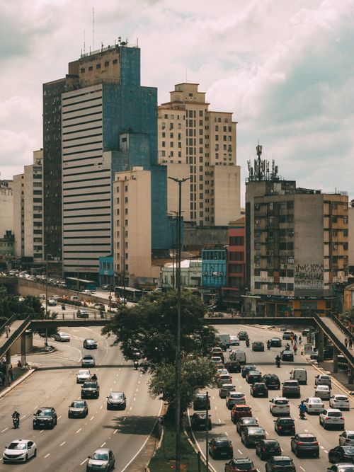 Free A bustling urban scene of São Paulo featuring high-rise buildings and heavy traffic on a sunny day. Stock Photo