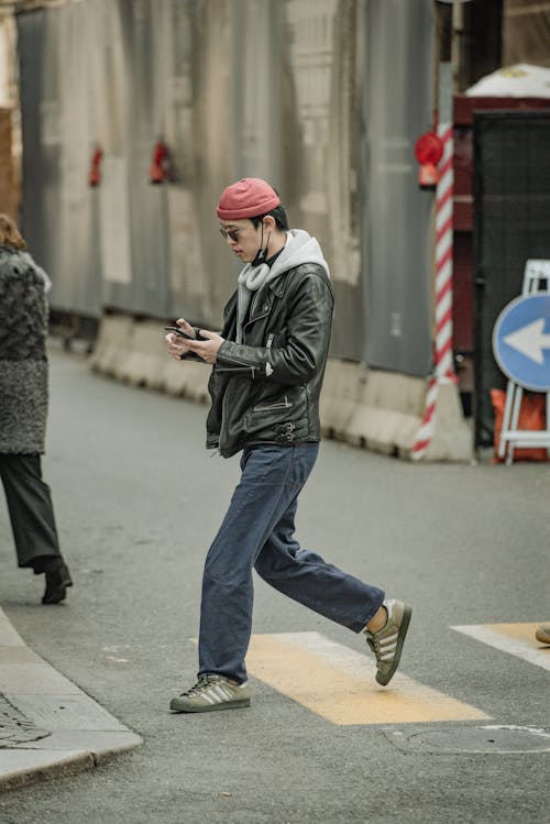 Man in Black Leather Jacket Crossing the Street