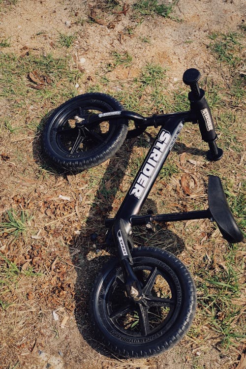 High-Angle Shot of a Strider Bicycle on the Ground