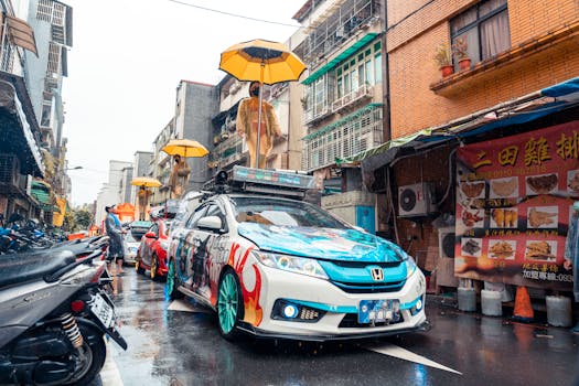 Vibrant cars in a lively city parade on rainy streets, featuring umbrellas and a festive atmosphere.