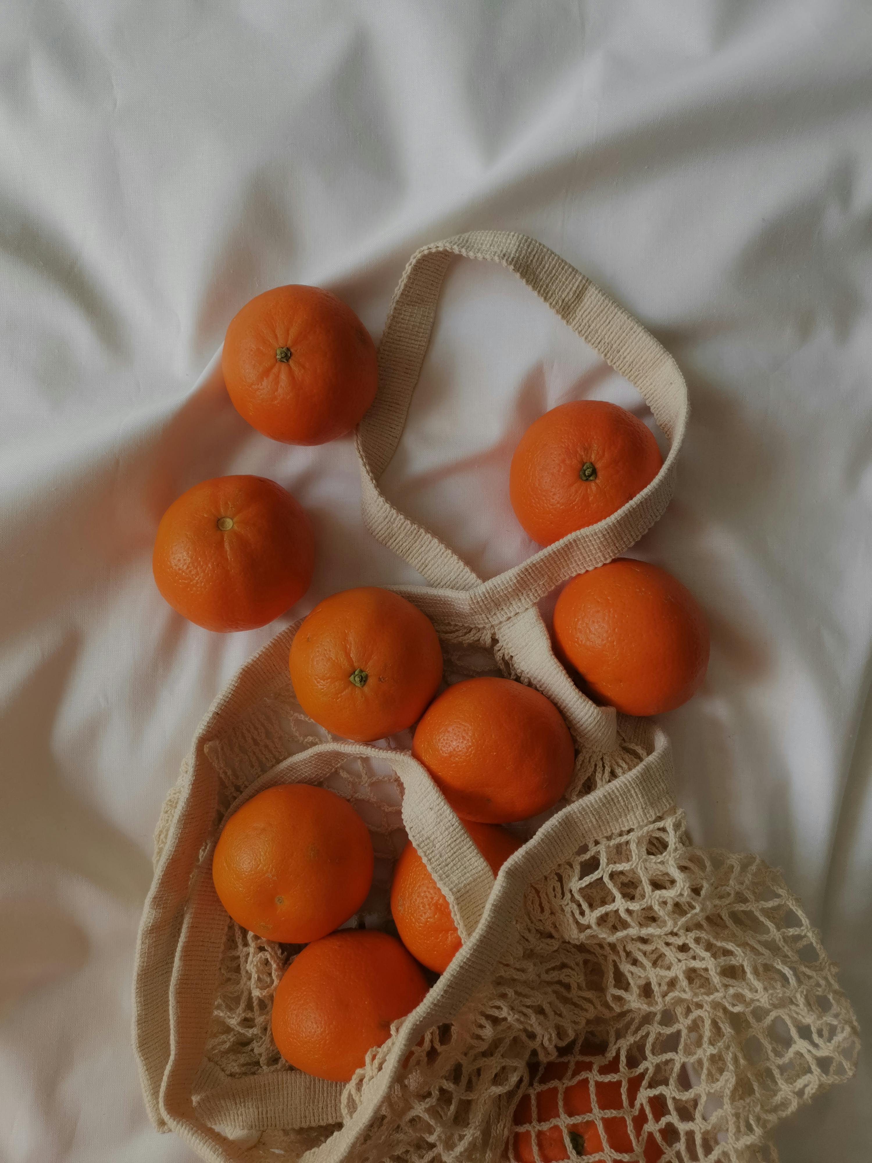 Lemon in a mesh bag. Stock Photo by Maliflower73