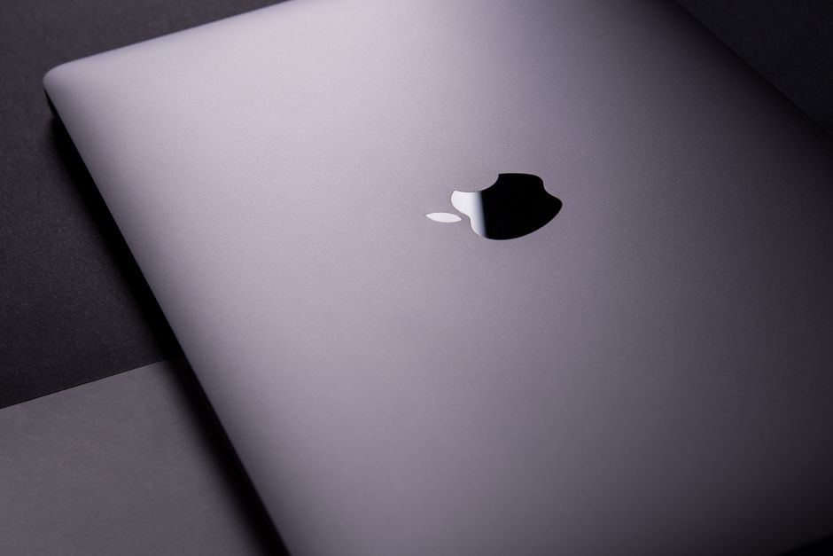 Close-up of a sleek, modern laptop featuring a minimalist design on a dark surface.
