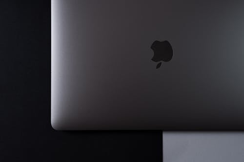 Free Gray MacBook Pro on White and Black Surface  Stock Photo