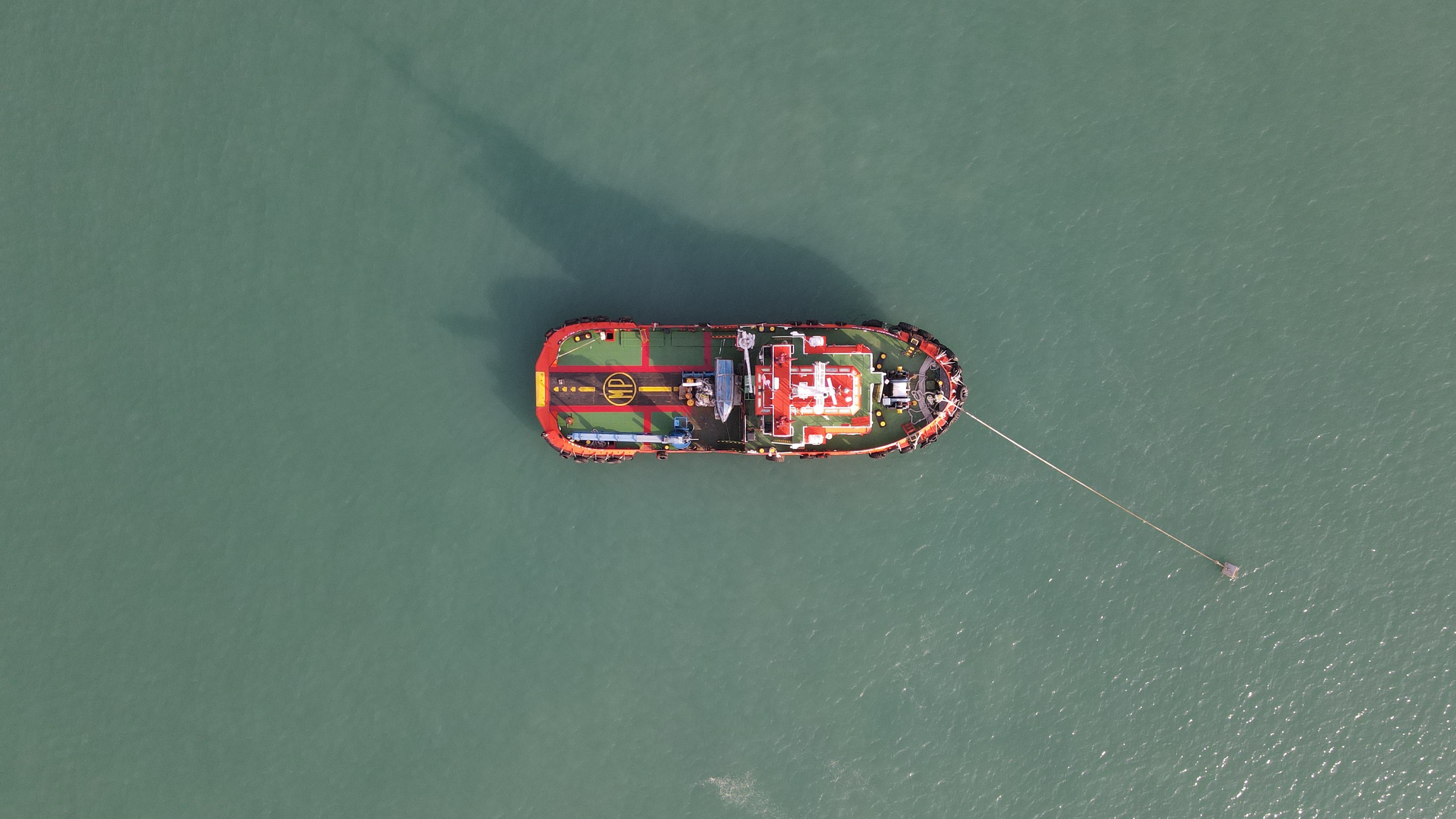 Aerial Footage of a Boat on Body of Water · Free Stock Photo