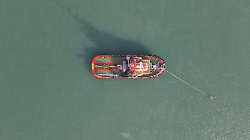 Aerial Footage of a Boat on Body of Water 