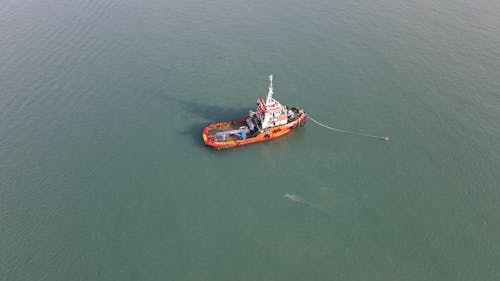 Aerial Footage of a Boat on Body of Water