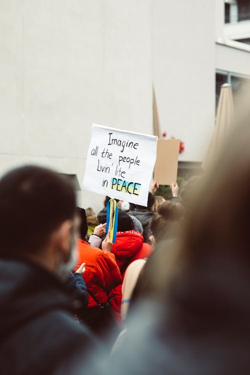 Free Crowd on the Street Holding Placards with Message  Stock Photo