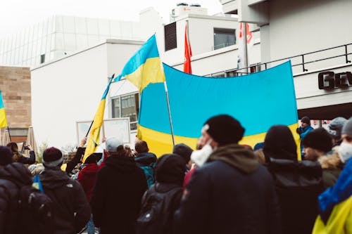 People Protesting While Holding Ukraine Flags