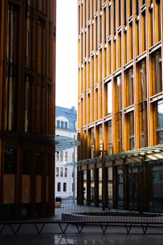 Vertical view of modern architectural buildings in Oslo with urban cityscape contrast.