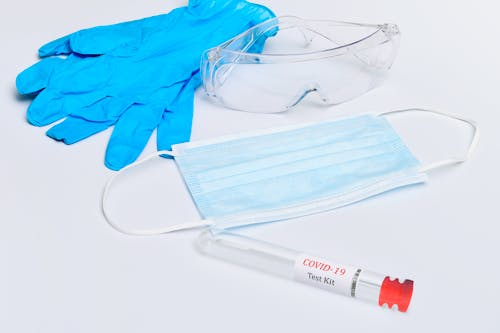 A Plastic Test Tube and Personal Protective Equipment