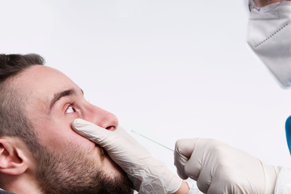 A Man Getting a Swab Test · Free Stock Photo