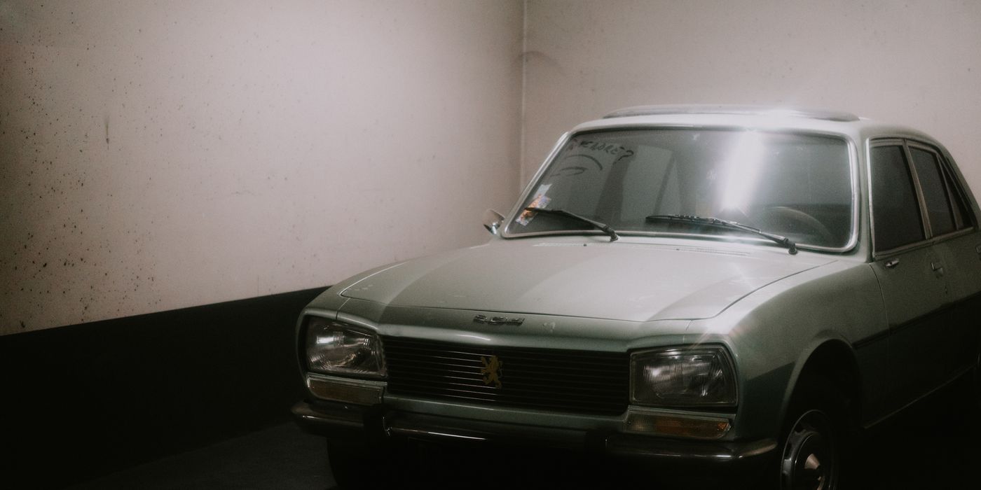 A classic sedan parked inside a garage