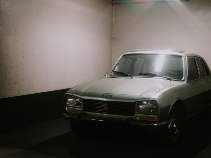 Car parked inside a clean finished garage
