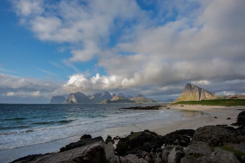 Free Breathtaking coastal landscape in Nordland with rocky mountains and cloudy sky. Stock Photo