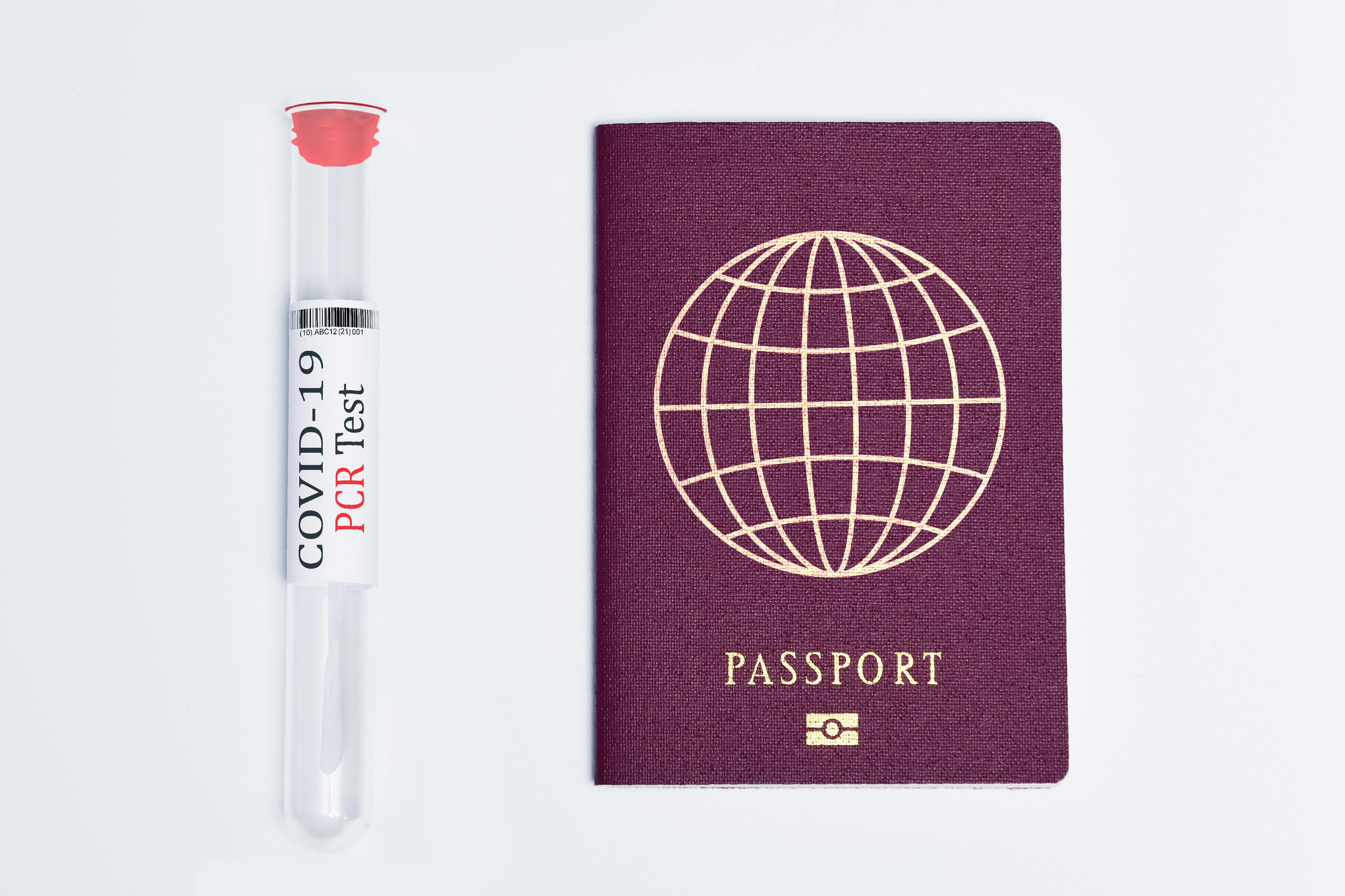 Travel essentials during the pandemic: a COVID-19 PCR test and a passport.
