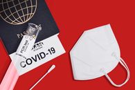 COVID-19 and travel concept, mark of coronavirus PCR testing in tourist Italian passport.Diagnostics of coronavirus in airport due to lockdown. Business and tourism hit by corona virus during