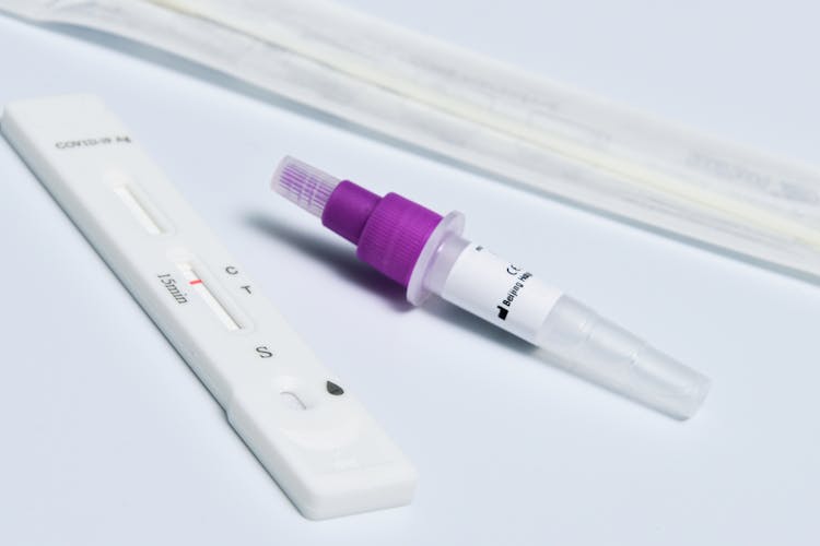 Rapid Antigen Test Kit On A Flat White Surface