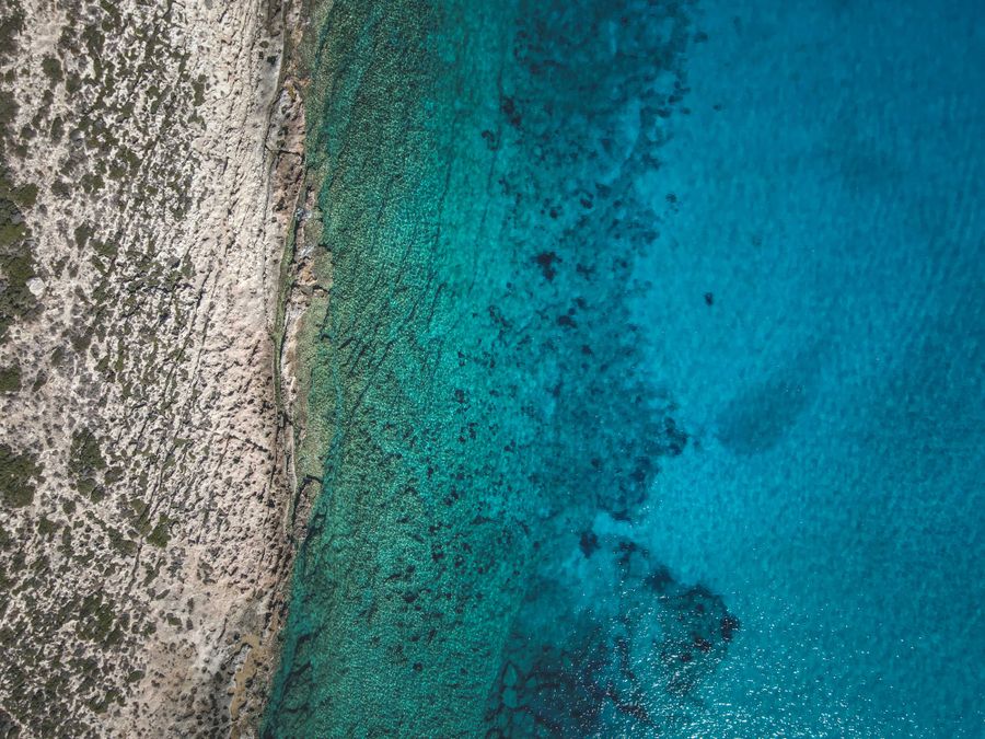 Turquoise coastline seen from above — photo by Francesco Ungaro on Pexels