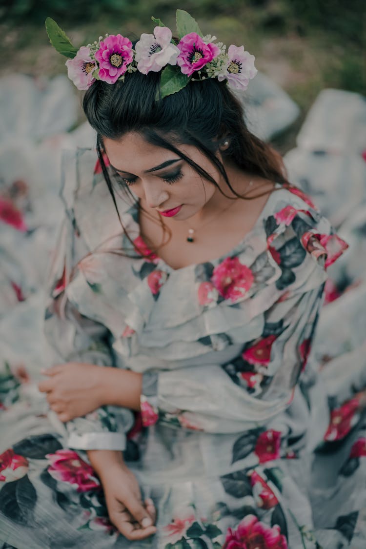 Woman In Floral Dress With Flowers On The Head