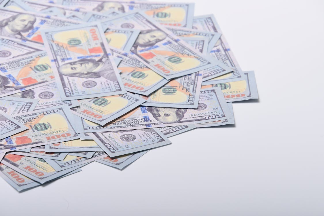Free Dollar Bills on White Surface Stock Photo