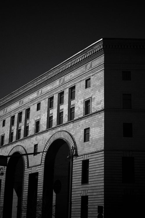 Free Striking black and white photo capturing the elegant architecture facade with archways. Stock Photo